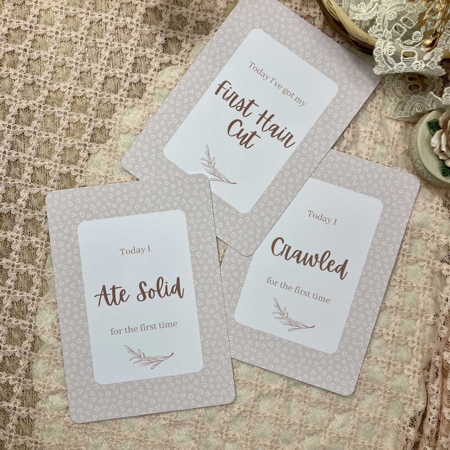 Three milestone cards with text on a textured surface