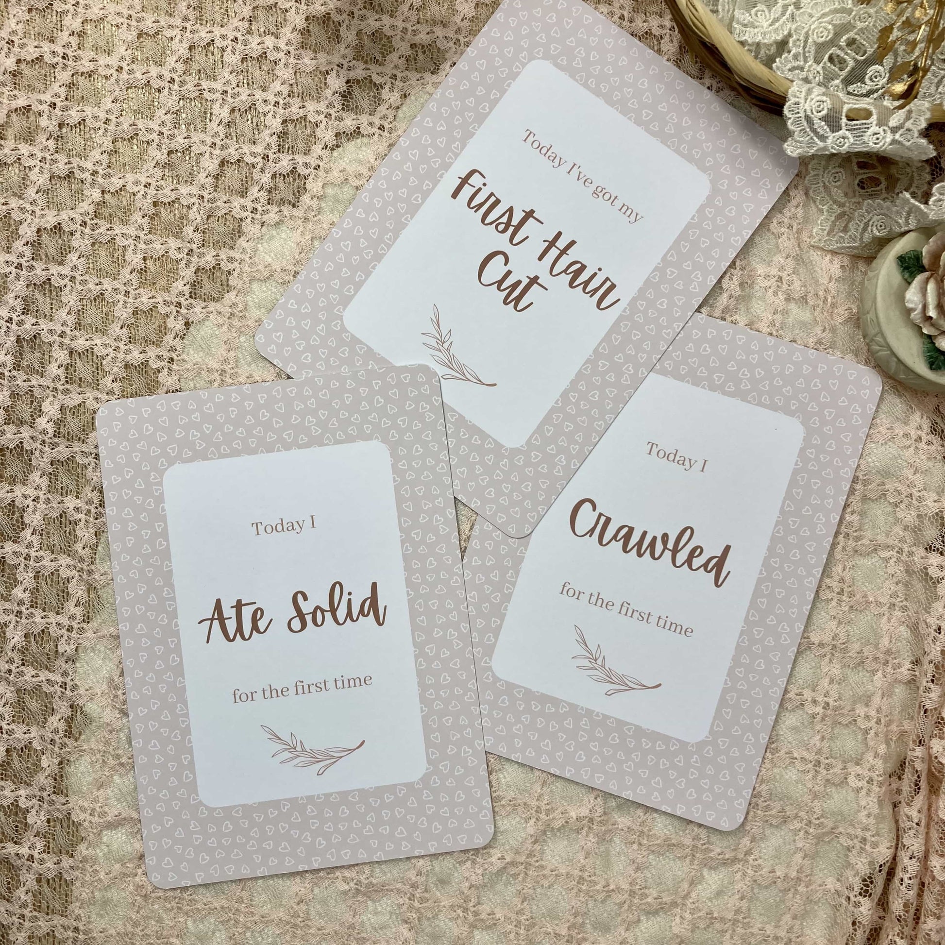 Three milestone cards with text on a textured surface