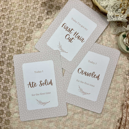 Three milestone cards with text on a textured surface